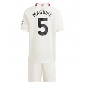 Manchester United Harry Maguire #5 Koszulka Trzecich Dziecięca 2023-24 Krótki Rękaw (+ Krótkie spodenki)